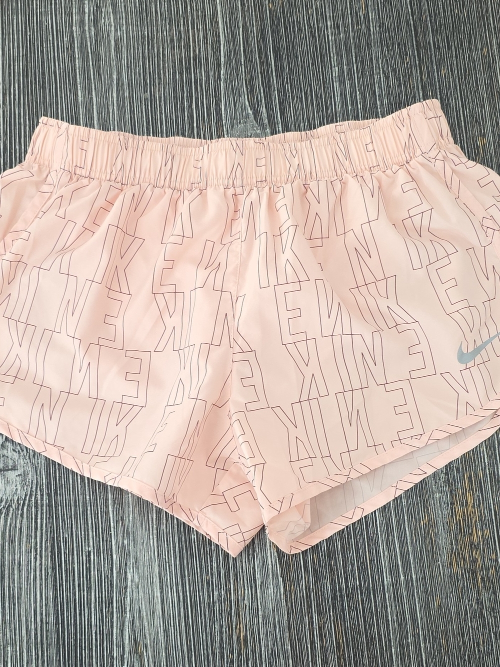 Nike Light Pink Athletic Running Shorts with Subtle Logo Print